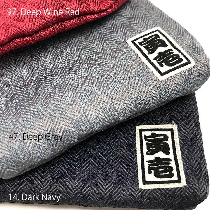 Toraichi brand label close-up on day-and-night herringbone coin purse