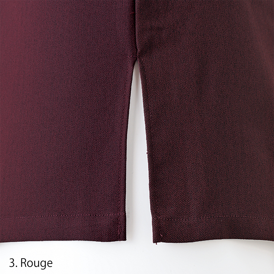 Three-quarter front view displaying flap chest pockets and hidden button placket