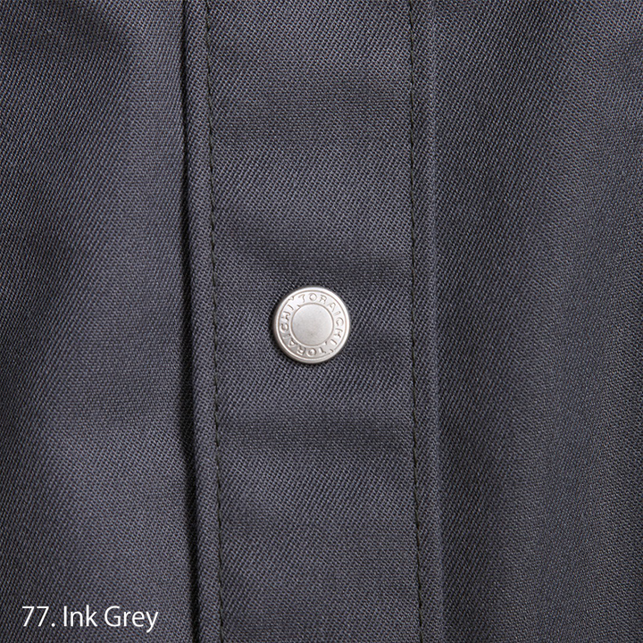 Flat lay of Toraichi tobi shirt in dark grey Japanese workwear design