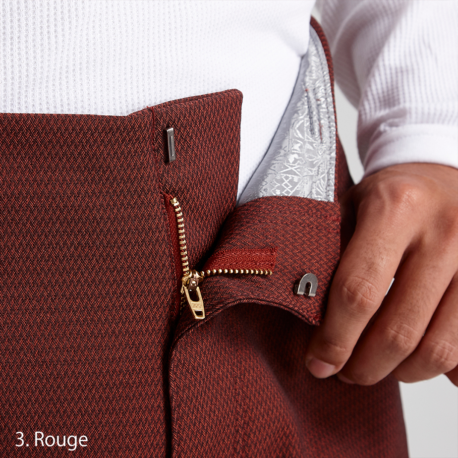 Back pocket detail of the Toraichi Japanese workwear trousers showing symmetrical placement and secure closure.