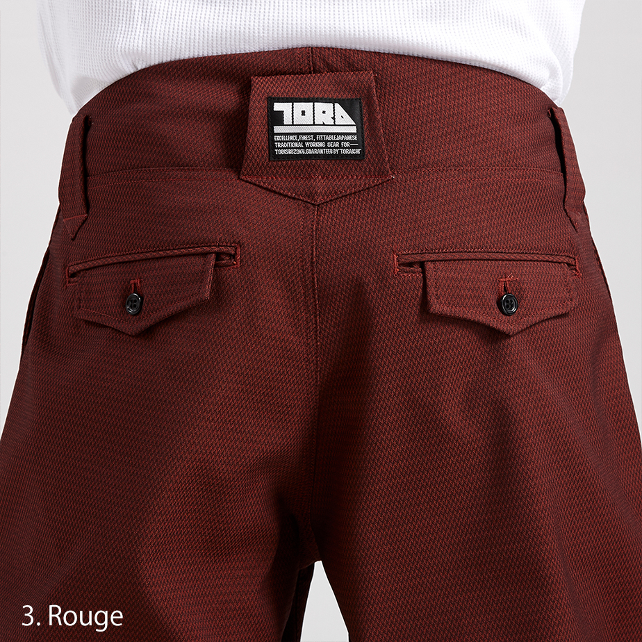 Front-close shot of the waistband and pleat structure on the Toraichi 7760-720 pants demonstrating refined tailoring.
