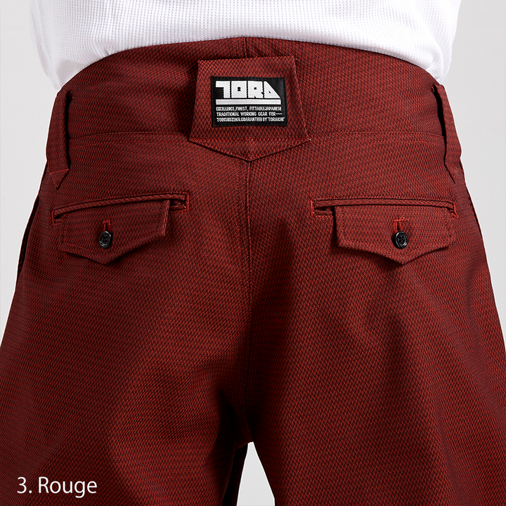 Front-close shot of the waistband and pleat structure on the Toraichi 7760-720 pants demonstrating refined tailoring.