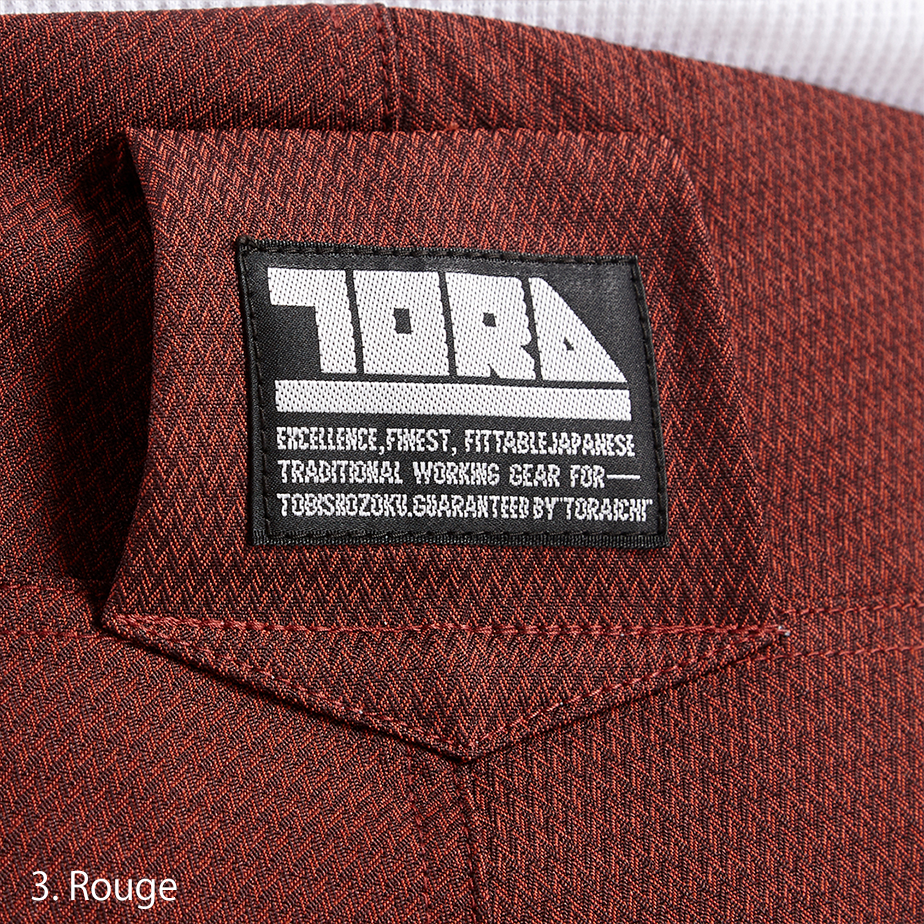 Rear view of the Toraichi Torastyle trousers highlighting tailored seams, buttoned back pockets, and a structured waistband.