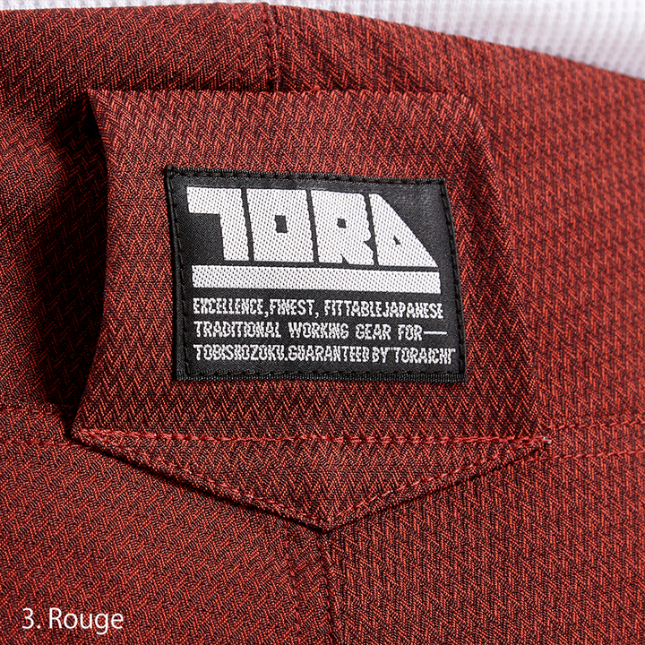 Rear view of the Toraichi Torastyle trousers highlighting tailored seams, buttoned back pockets, and a structured waistband.
