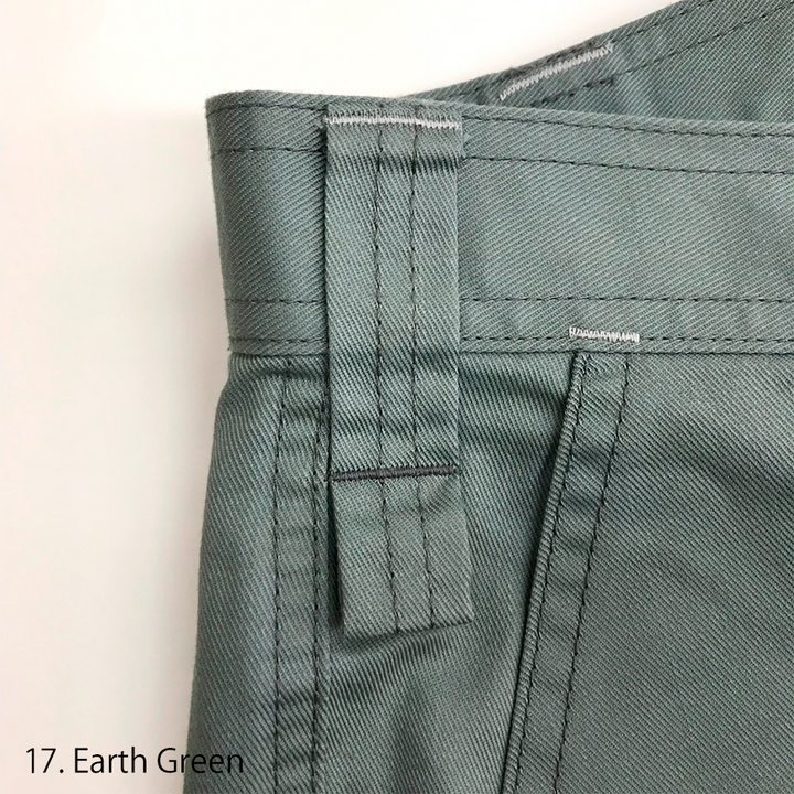 Model wearing the Toraichi 2130-219 cargo pants in white with matching work jacket, showing a clean industrial silhouette and ergonomic knee design.