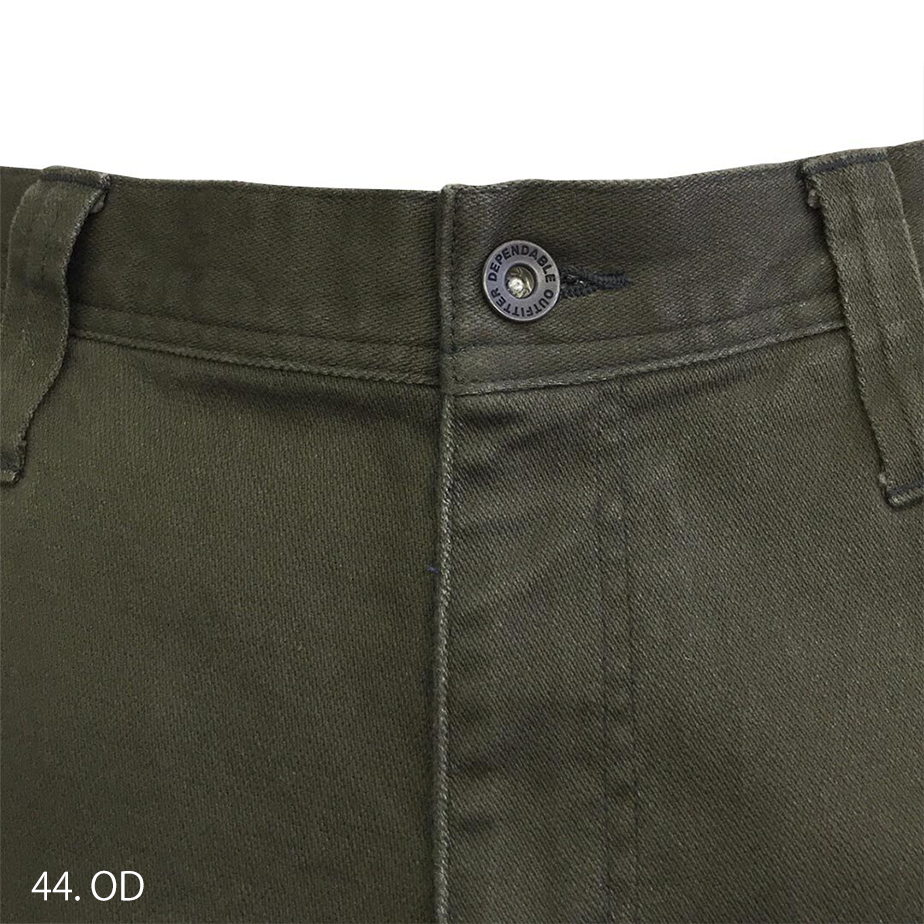 Side angle of stretch cargo pants showing slim tapered silhouette and ergonomic knee design