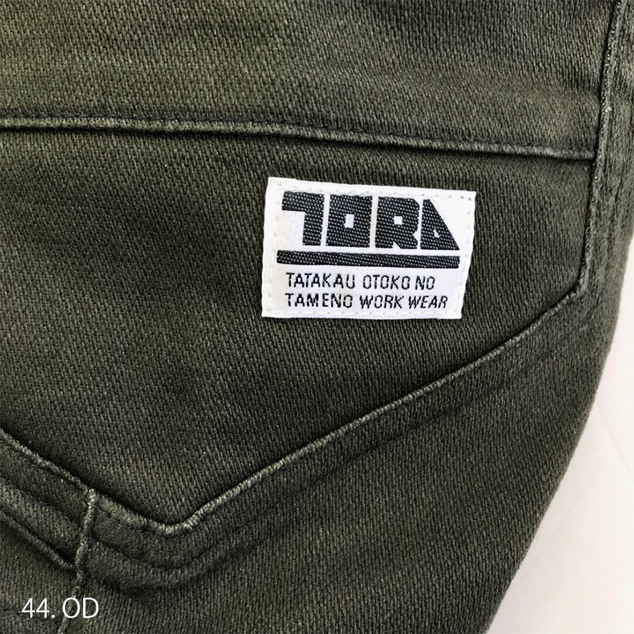 Waistband close-up showing sturdy belt loops and reinforced back seam