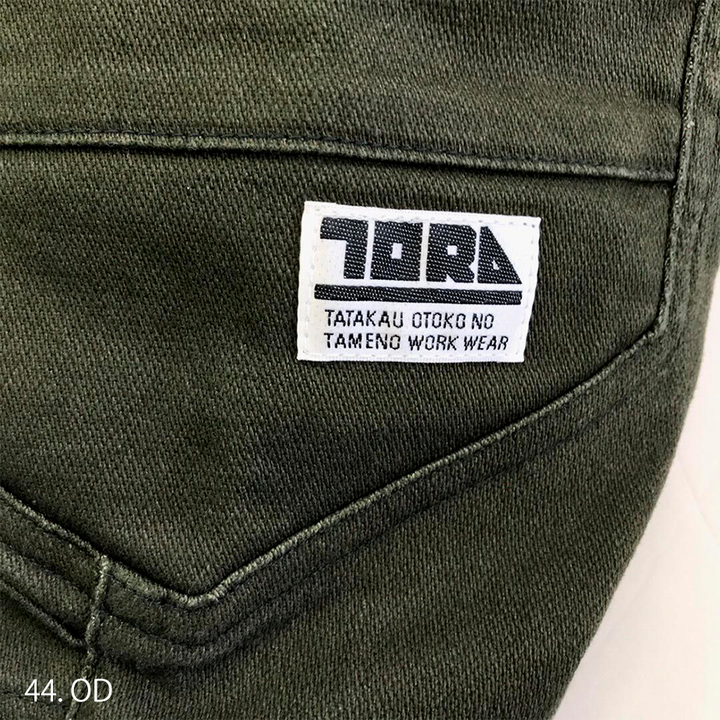 Waistband close-up showing sturdy belt loops and reinforced back seam