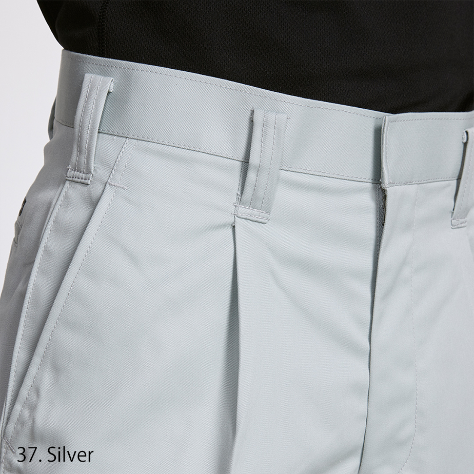 Close-up of waistband and tuck detail on Toraichi Japanese workwear pants in light grey