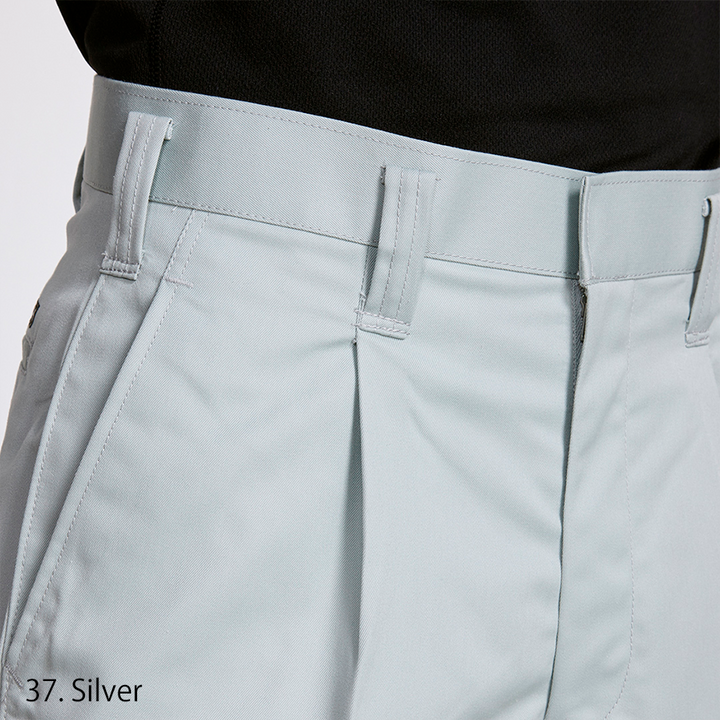 Close-up of waistband and tuck detail on Toraichi Japanese workwear pants in light grey