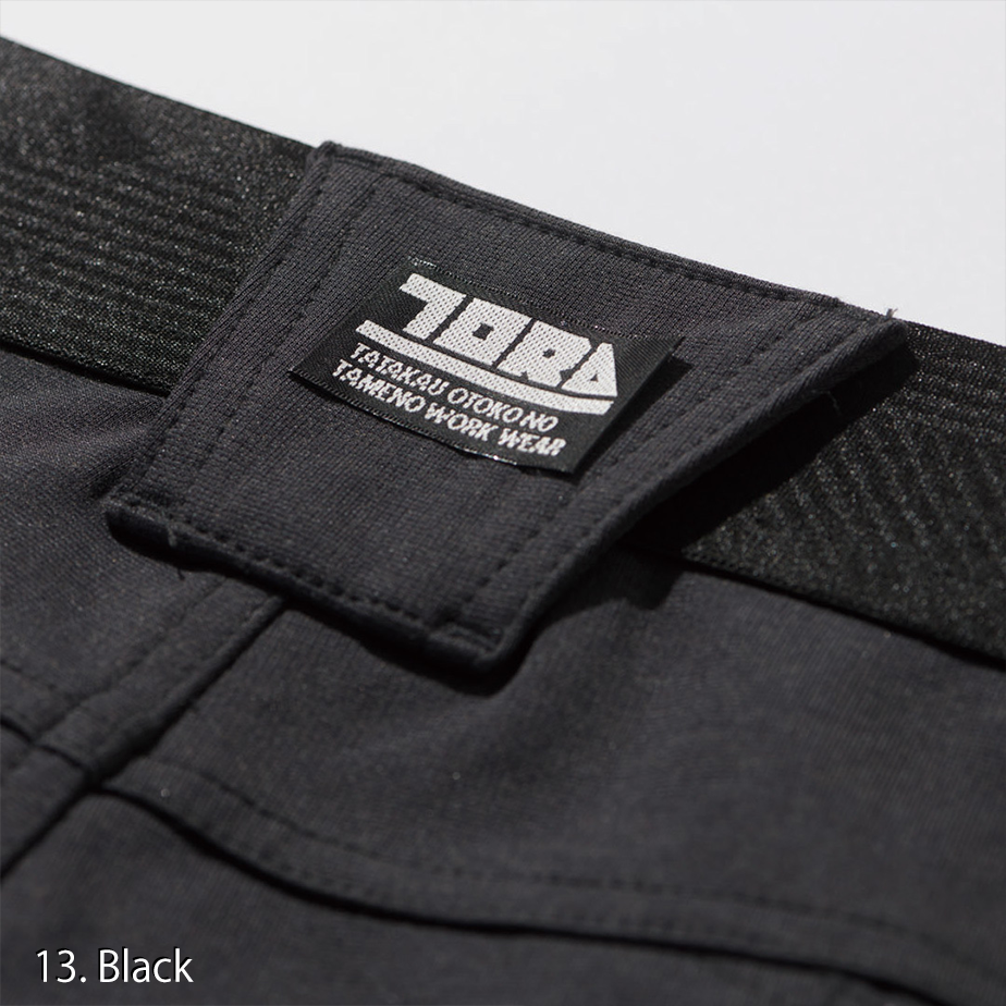 Macro shot of the knee articulation stitching on the Toraichi 9276-235 pants for flexibility during motion.