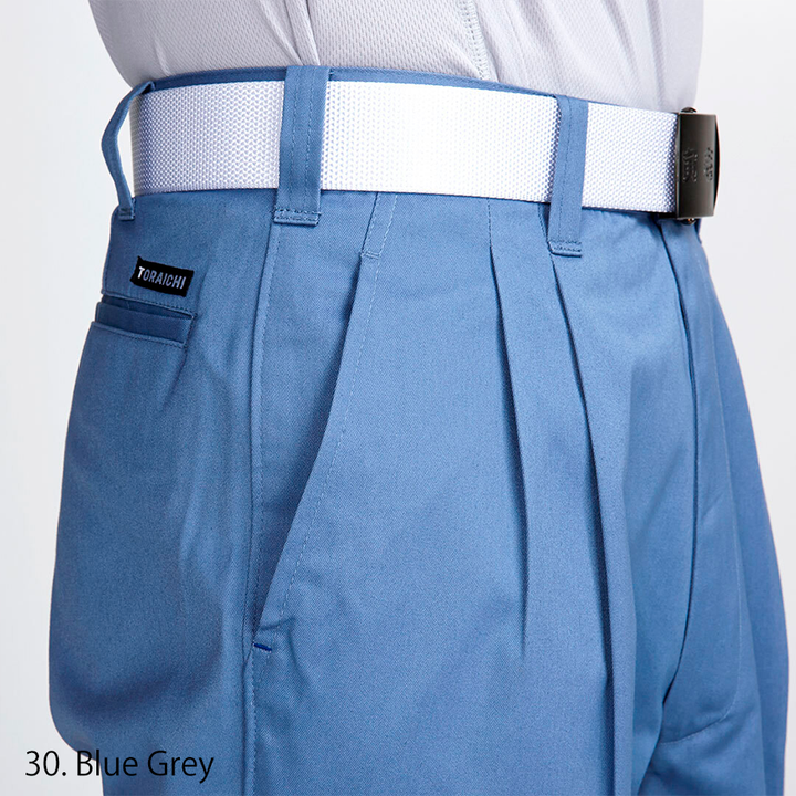 Modern Japanese workwear blue-grey two-tuck pants, full body side profile