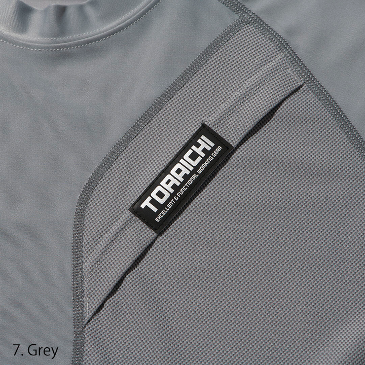 Close-up of the chest pocket with tonal logo tag on the Toraichi Japanese workwear crew neck shirt demonstrating functional design.