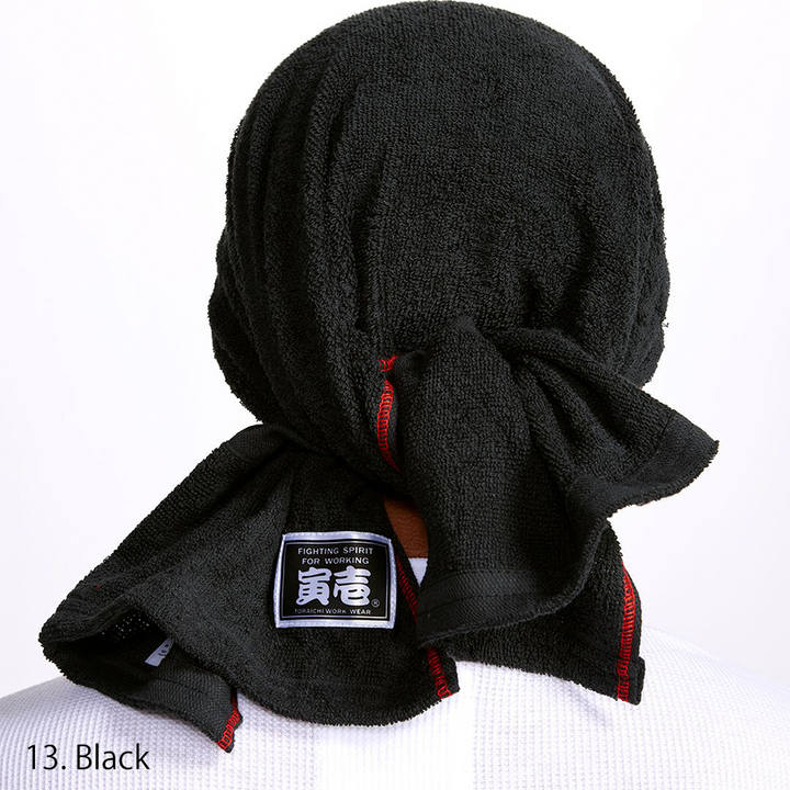 Back view of the same black towel showing red-edged stitching and label details