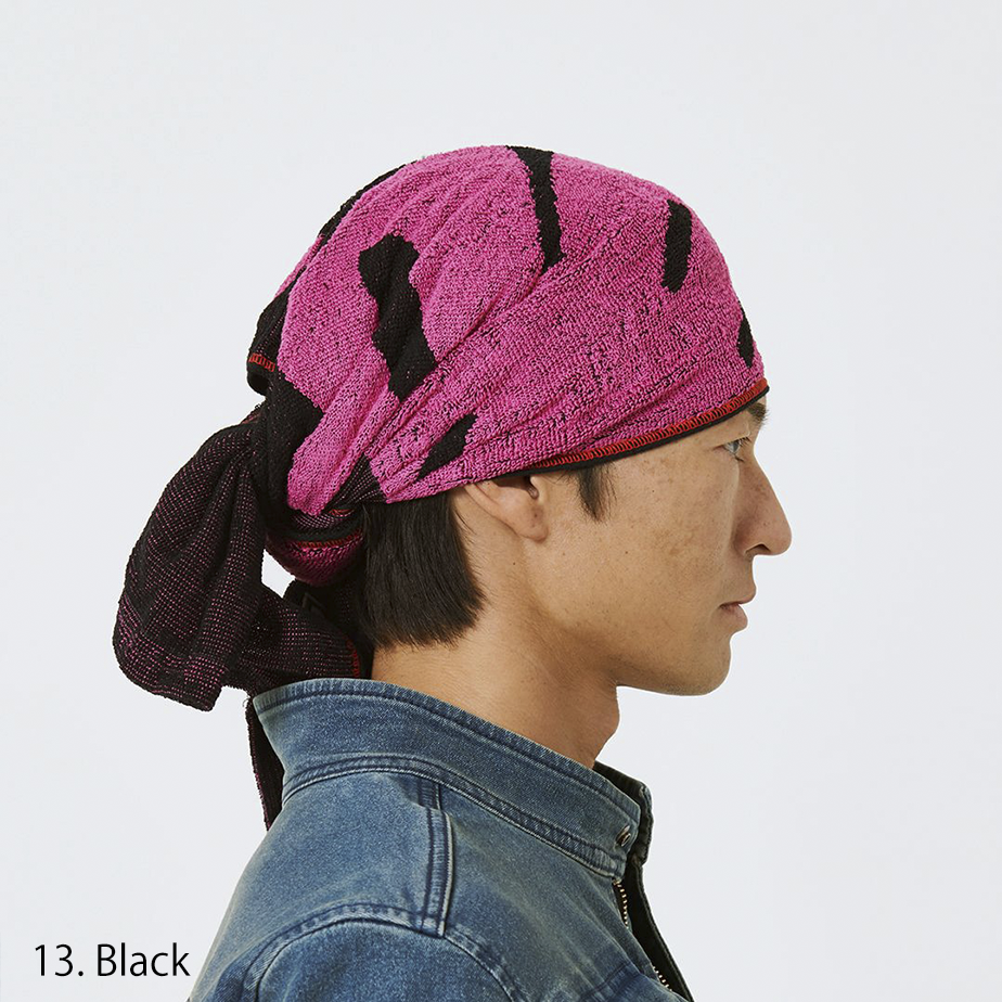 Three-quarter view showing black and red towel texture and logo pattern