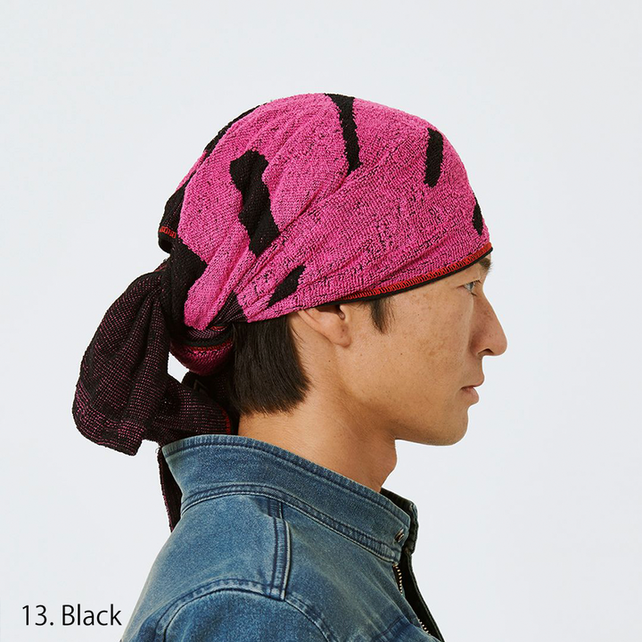 Three-quarter view showing black and red towel texture and logo pattern
